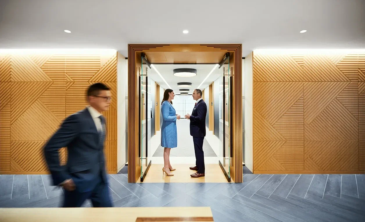 Two people talking in office